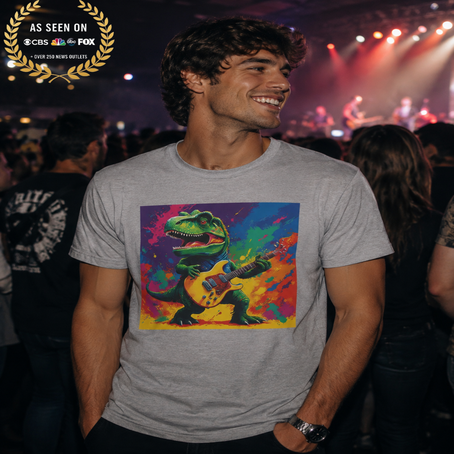 Man wearing a t-shirt with a colorful dinosaur playing guitar design at a concert.