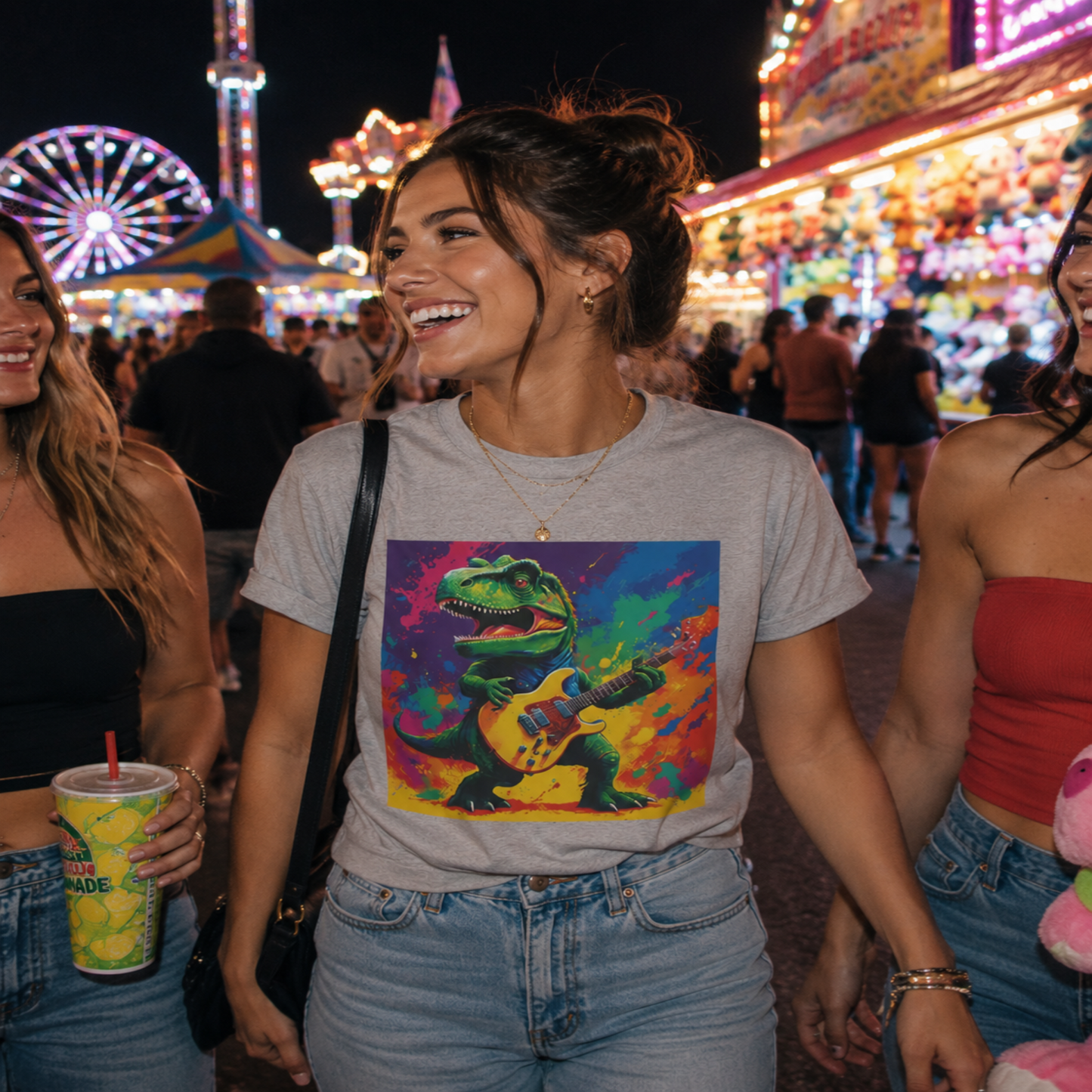 Woman wearing a colorful t-shirt with a graphic design at a fairground.