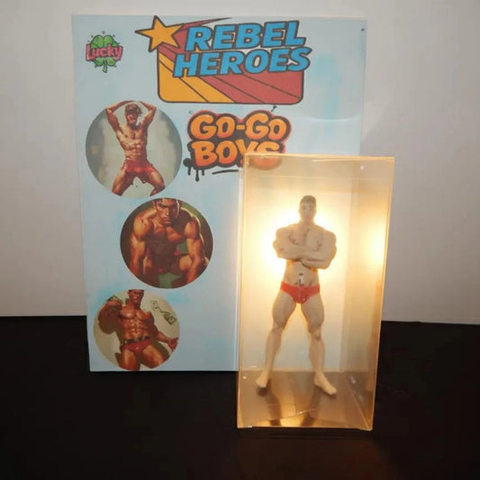 Rebel Heroes Go-Go Boys action figure with packaging on a dark surface