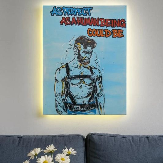 Painting with a stylized illustration of Lincoln on a blue background, displayed above a gray sofa with a vase of flowers.